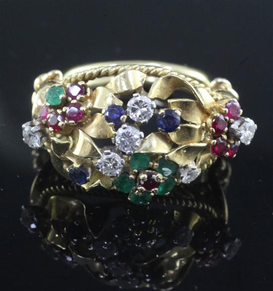 An ornate gold and multi gem set cocktail ring, size P.